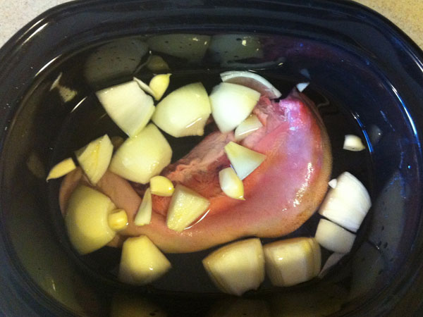 Photo of raw elk tongue in a crockpot