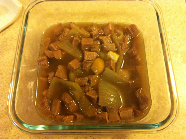 Photograph of cubed elk tongue with onions and garlic